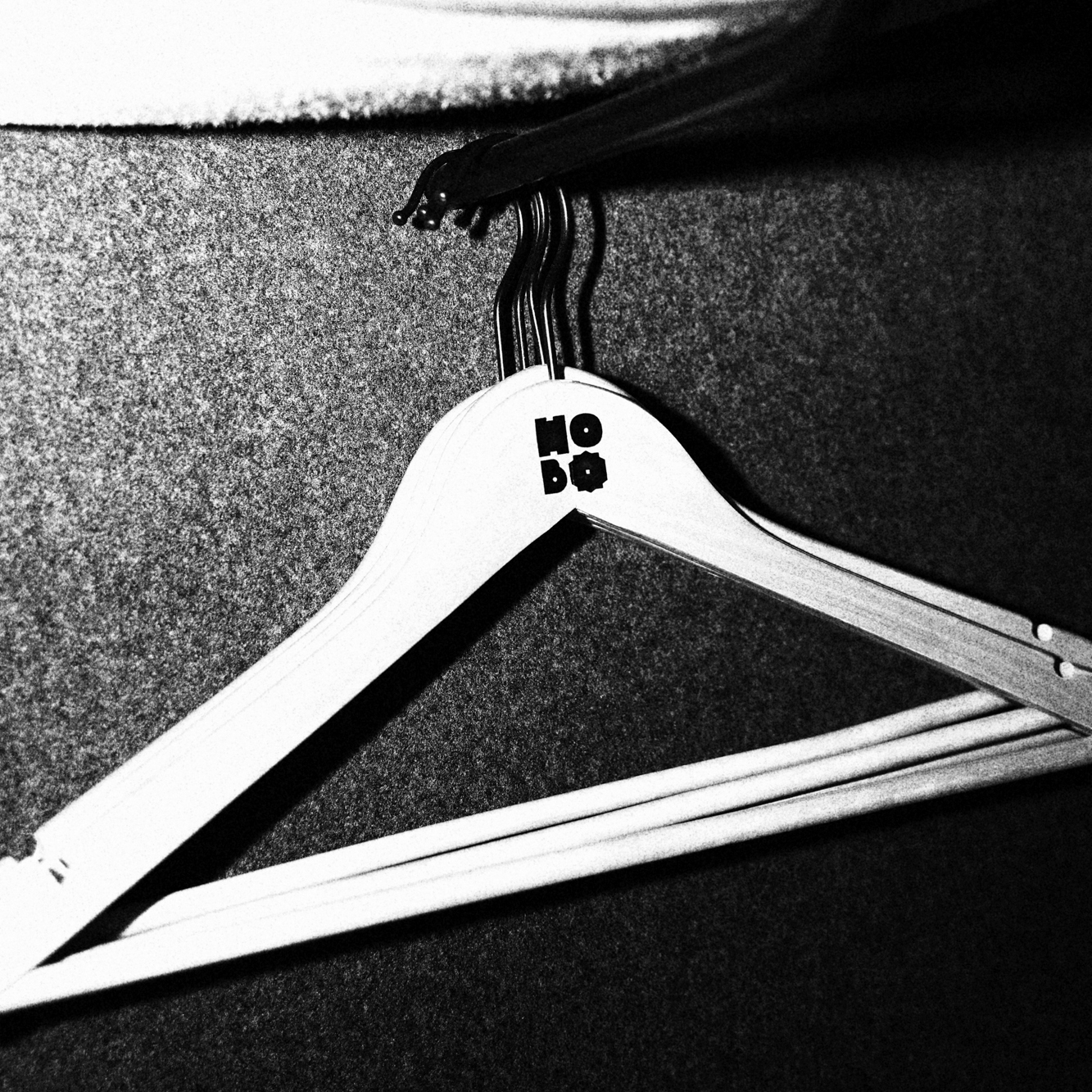 White Hobo clothes hanger, in black and white